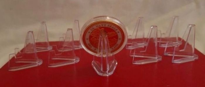 Medal / badge / coin display stands . Lot of (10)