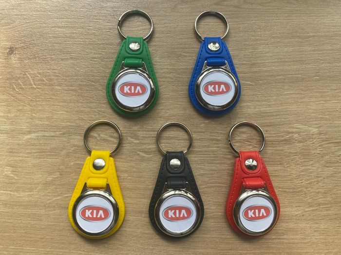 Brand new synthetic leather Kia key ring with shopping trolley token/coin