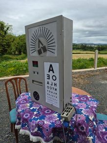 vintage optician's illuminated eye test chart, commonly used in the mid-20th century.