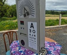 vintage optician's illuminated eye test chart, commonly used in the mid-20th century.