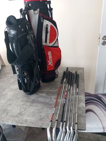 Kids golf clubs and bags.
