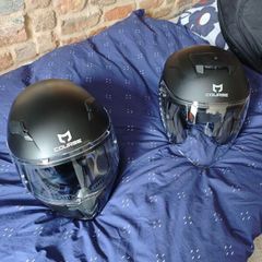 pair of helmets, one full face one open face