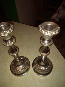 Set of tow silver plated candle holder.  23.5 cm. tall