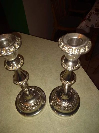 Set of tow silver plated candle holder.  23.5 cm. tall