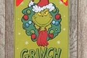 The Grinch 500 Piece Double-Sided Puzzle in a Tin