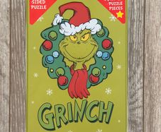 The Grinch 500 Piece Double-Sided Puzzle in a Tin