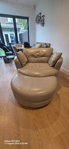 Leather swivel/ cuddle chair with footstool