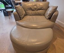 Leather swivel/ cuddle chair with footstool