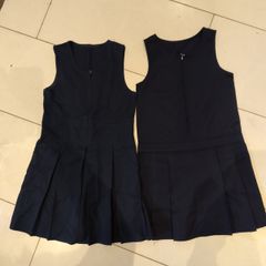 two navy pinafores size 8-9