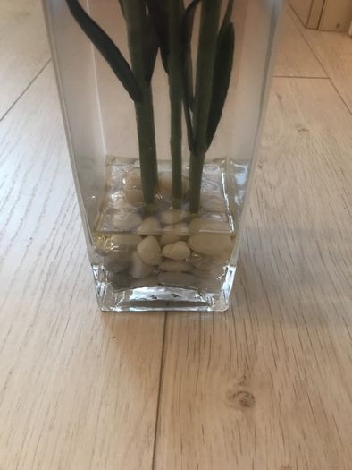 Glass vase and faux carnations