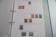 A collection of stamps from various countries on pages in binder (1880s-1990s)