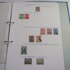 A collection of stamps from various countries on pages in binder (1880s-1990s)