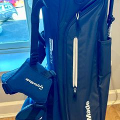 NEW - TaylorMade FlexTech Stand Bag (Black/Blue), stand legs still have the factory wrapping on them.