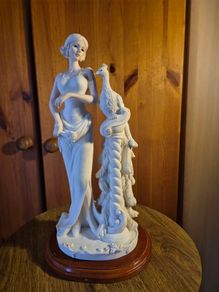 Vintage Lady and A Peacock Sculpture