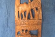 Hand-carved wooden wall hanging