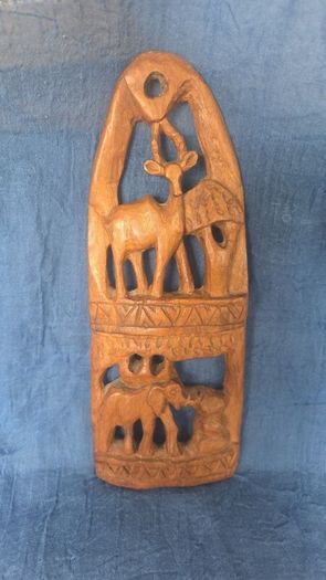 Hand-carved wooden wall hanging