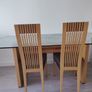 Grey fabric sofa and glass top dining table set Image 3