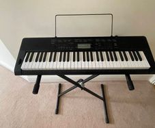 Casino portable keyboard with stand and footpedal.