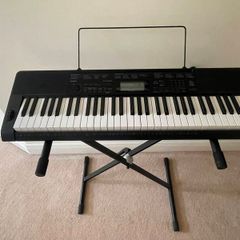 Casino portable keyboard with stand and footpedal.