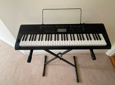 Casino portable keyboard with stand and footpedal.