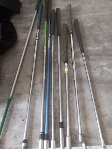 A selection of junior golf clubs and bag.