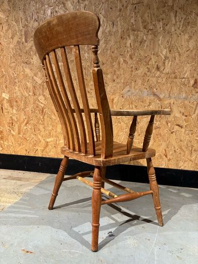 A Late Victorian farmhouse armchair.