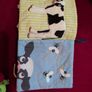 Baby sensory books and a rattle toy Image 2