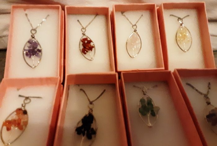 selection of homemade white metal necklaces