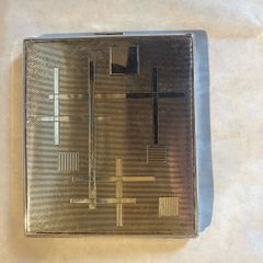 cigarette or card caseThis is a mid-century modern silver-plated cigarette case featuring an abstract, geometric grid and line pattern.