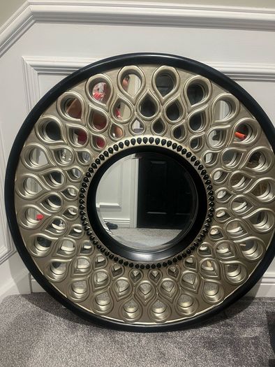 round ornate mirror