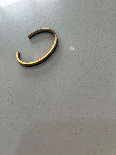 Calvin Klein black and gold bangle