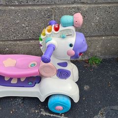 Kids ride on toy that turns into scooter