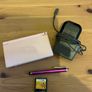 Pink Nintendo DS lite with charger and games Image 2