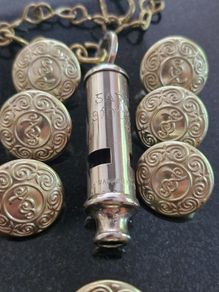 An Early Garda Siochana Whistle And Set Of 7 Buttons