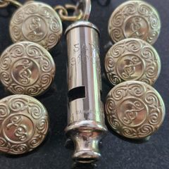 An Early Garda Siochana Whistle And Set Of 7 Buttons