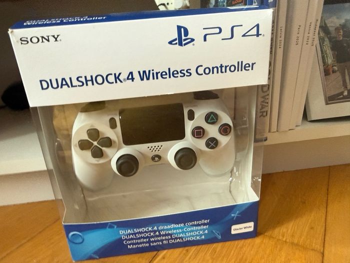 PS4 console with dual shock 4 controller and two COD games