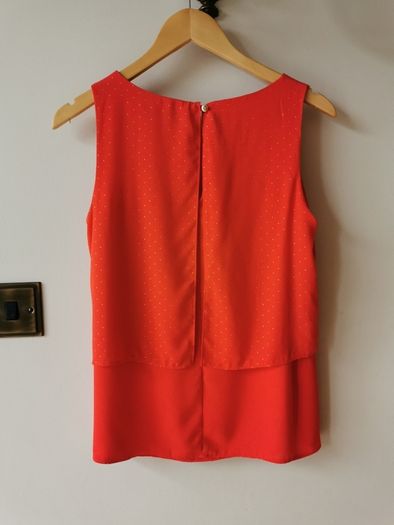 Orange/red sleeveless top