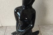 Vintage statue of a seated woman, nude figure, ceramic, glossy black.