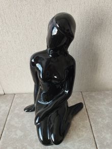 Vintage statue of a seated woman, nude figure, ceramic, glossy black.