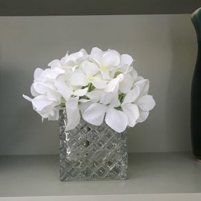 artifical white hydrangea flower and glass vase