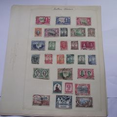 A collection of stamps from Northern Rhodesia, Southern Rhodesia, Rhodesia, South Africa and Nyasaland on loose pages