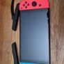 Nintendo Switch OLED Neon and accessories Image 8