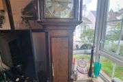 A Georgian grandfather clock made by the English clockmaker John Rogers of Leominster