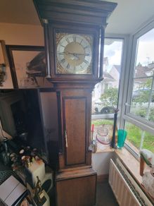 A Georgian grandfather clock made by the English clockmaker John Rogers of Leominster