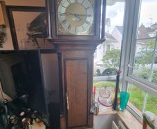 A Georgian grandfather clock made by the English clockmaker John Rogers of Leominster