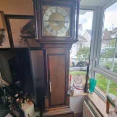 A Georgian grandfather clock made by the English clockmaker John Rogers of Leominster