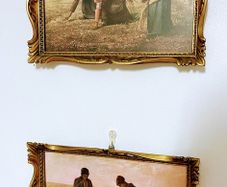 Pair of vintage reproductions behind glass