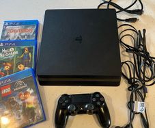 PS4 Slim 1 TB storage version with games and controller