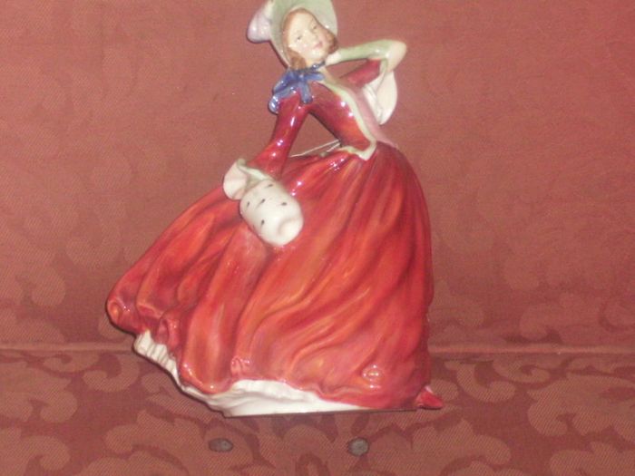 a royal doulton figure of a girl