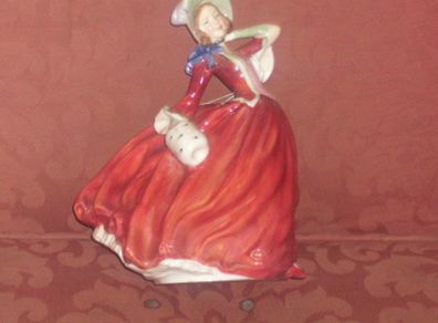 a royal doulton figure of a girl
